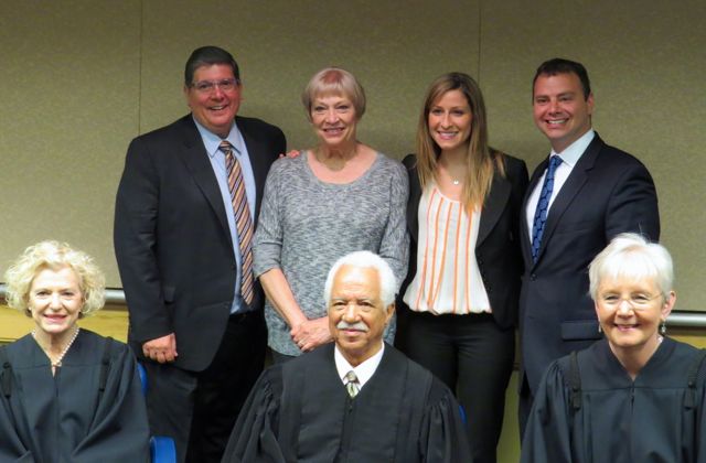 ISBA 2nd Vice President Richard D. Felice (rear, left) is shown with new admittee Stephanie Sainsbury (rear, second from left), her mother and Justinian Society President Gregg Garofalo. Seated at front are Illinois Suprme Court Justices Anne Burke, Charles Freeman and Mary Jane Theis.