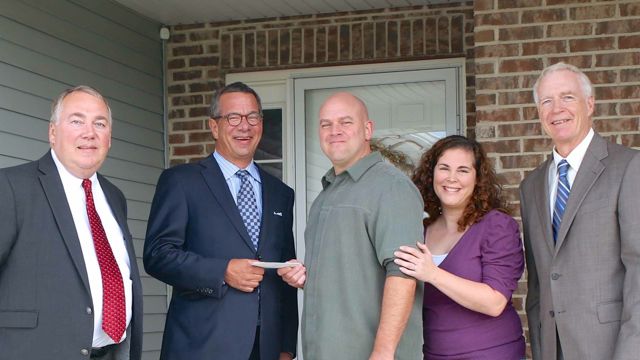 Attorneys’ Title Guaranty Fund, Inc. celebrates its three millionth title policy. From left, attorney Richard Fiocchi of Richard Fiocchi of Bernabei, Balestri & Fiocchi, who issued the policy, ATG  President & CEO Peter J. Birnbaum, homeowners William and Jill Thompson, and Jerry Gorman, ATG Senior Vice President – Downstate Operations. 