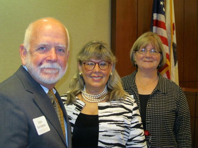 Sandberg Phoenix Managing Partner John Sandberg, ISBA President Paula H. Holderman, and Kathleen Pine, a lawyer in Sandberg Phoenix's Carbondale office