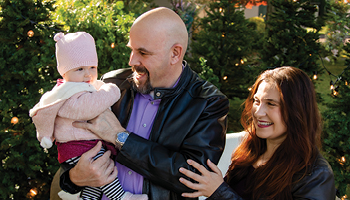 ISBA President Anna Krolikowska and Eric Hanis with their daughter, Lily.